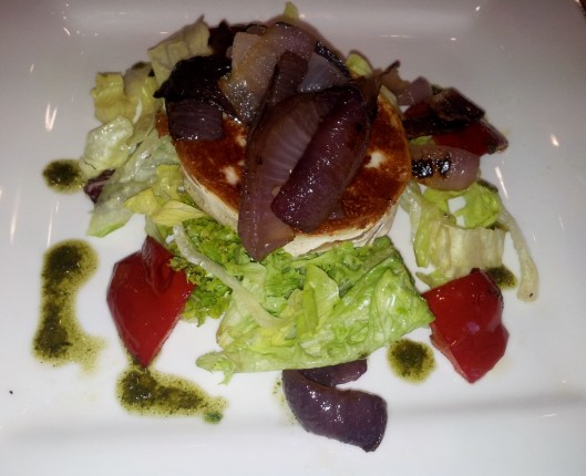 goats cheese with salad and caramelized onions